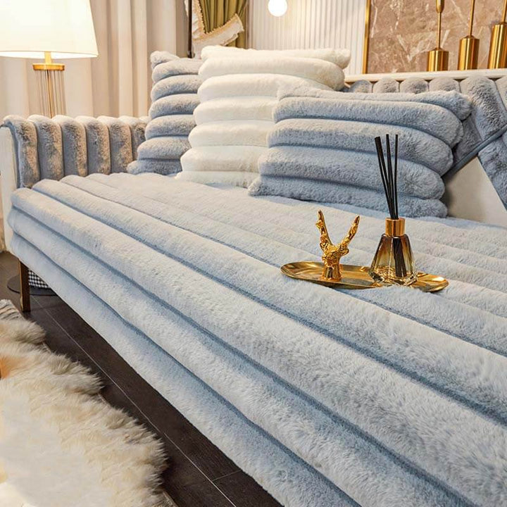 Non-slip backing of a striped couch cover, designed to keep the sofa protector securely in place.