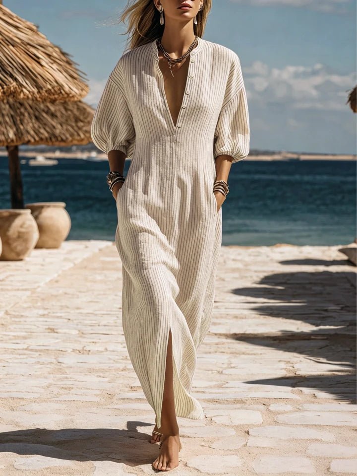 Striped V-neck maxi dress for women, featuring puff sleeves & side split. Ideal summer beachwear.