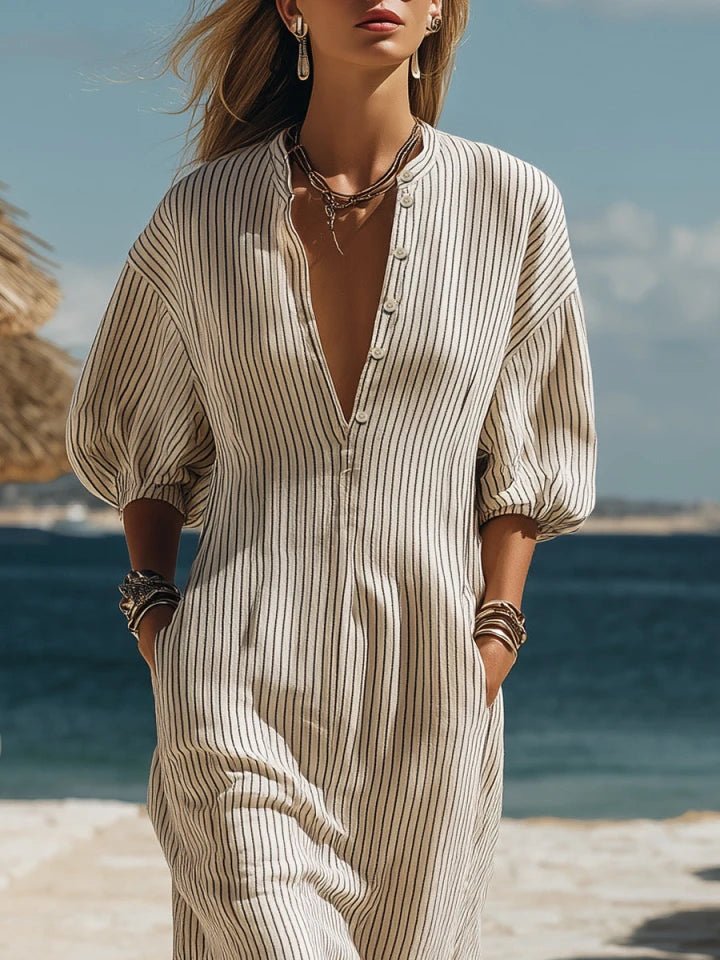 Vacation-ready striped V-neck maxi dress with puff sleeves and a stylish side split. Flowy beachwear.