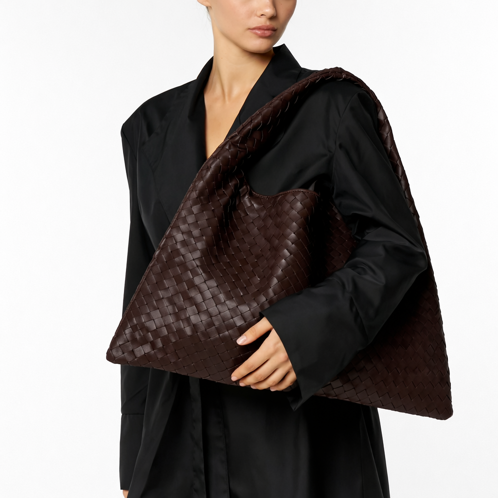Stylish brown braided hobo shoulder bag for women. Versatile everyday fashion accessory with a unique texture.