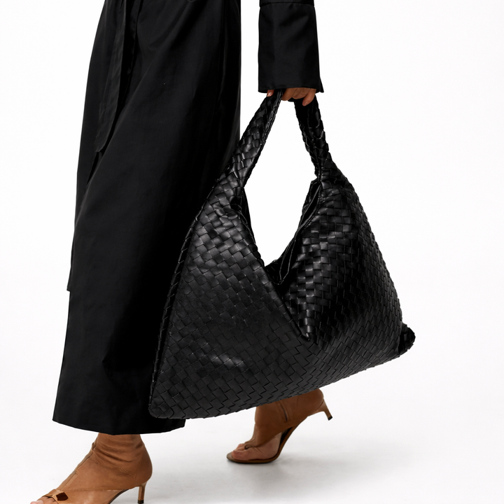 Elegant black braided hobo shoulder bag for women. A chic and versatile accessory for any occasion.