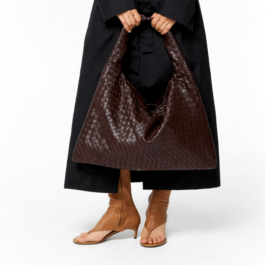 Women's brown braided hobo shoulder bag, featuring intricate woven details and a spacious interior for everyday use.