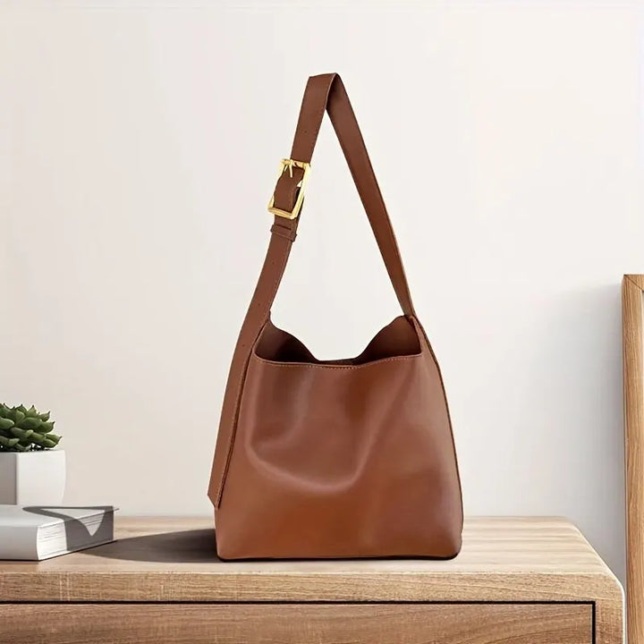 Stylish brown women's modern shoulder bag, perfect for everyday use and versatile fashion accessory.