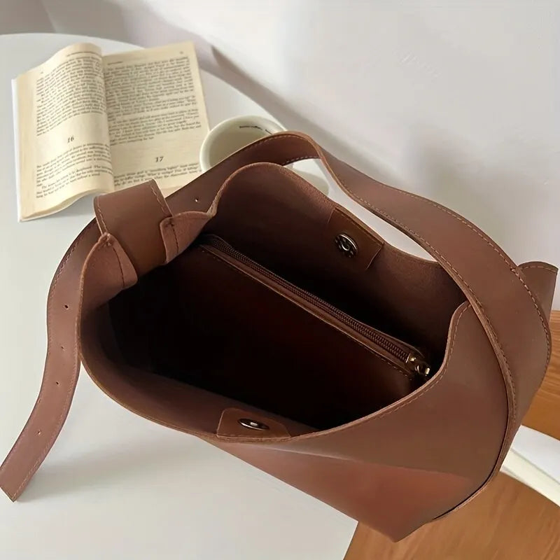 Sophisticated brown everyday handbag for women, a modern versatile accessory for elegant fashion.