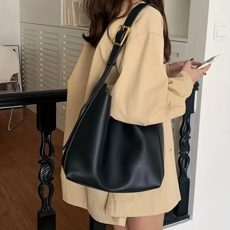 Classic black women's shoulder bag, perfect for everyday modern style and versatile fashion looks.