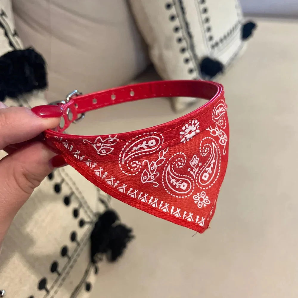 Adjustable cat bandana collar, a stylish pet accessory made with polyester & PU leather for comfortable wear.