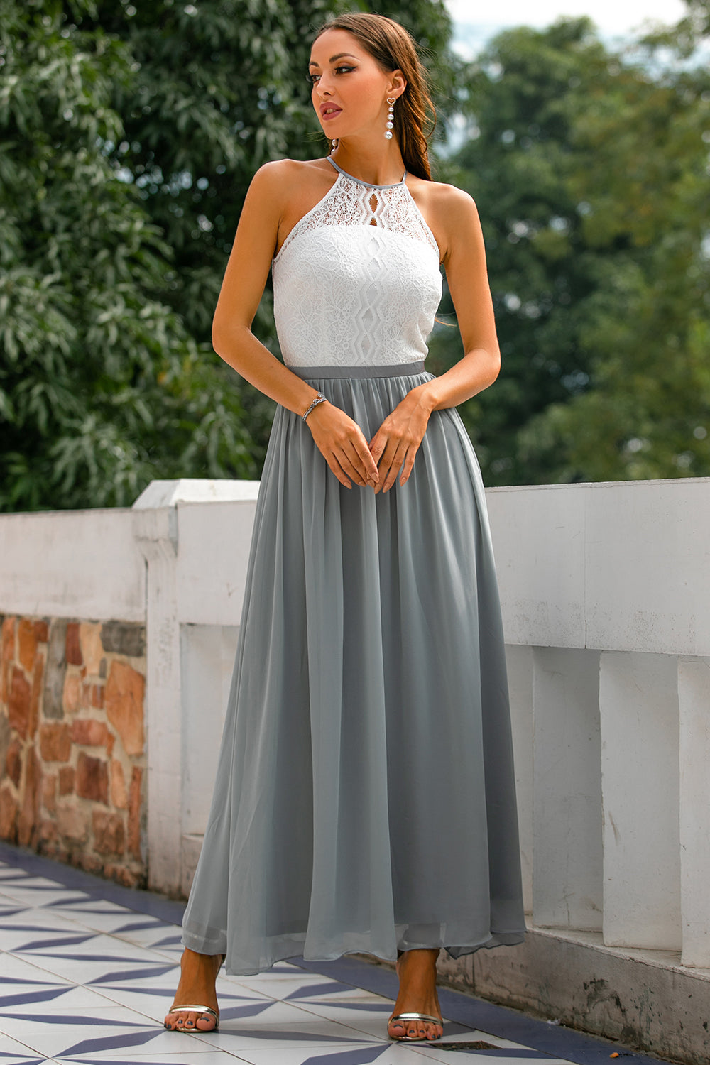 Front view of an elegant halter neck maxi dress, ideal for women attending a wedding or formal event.