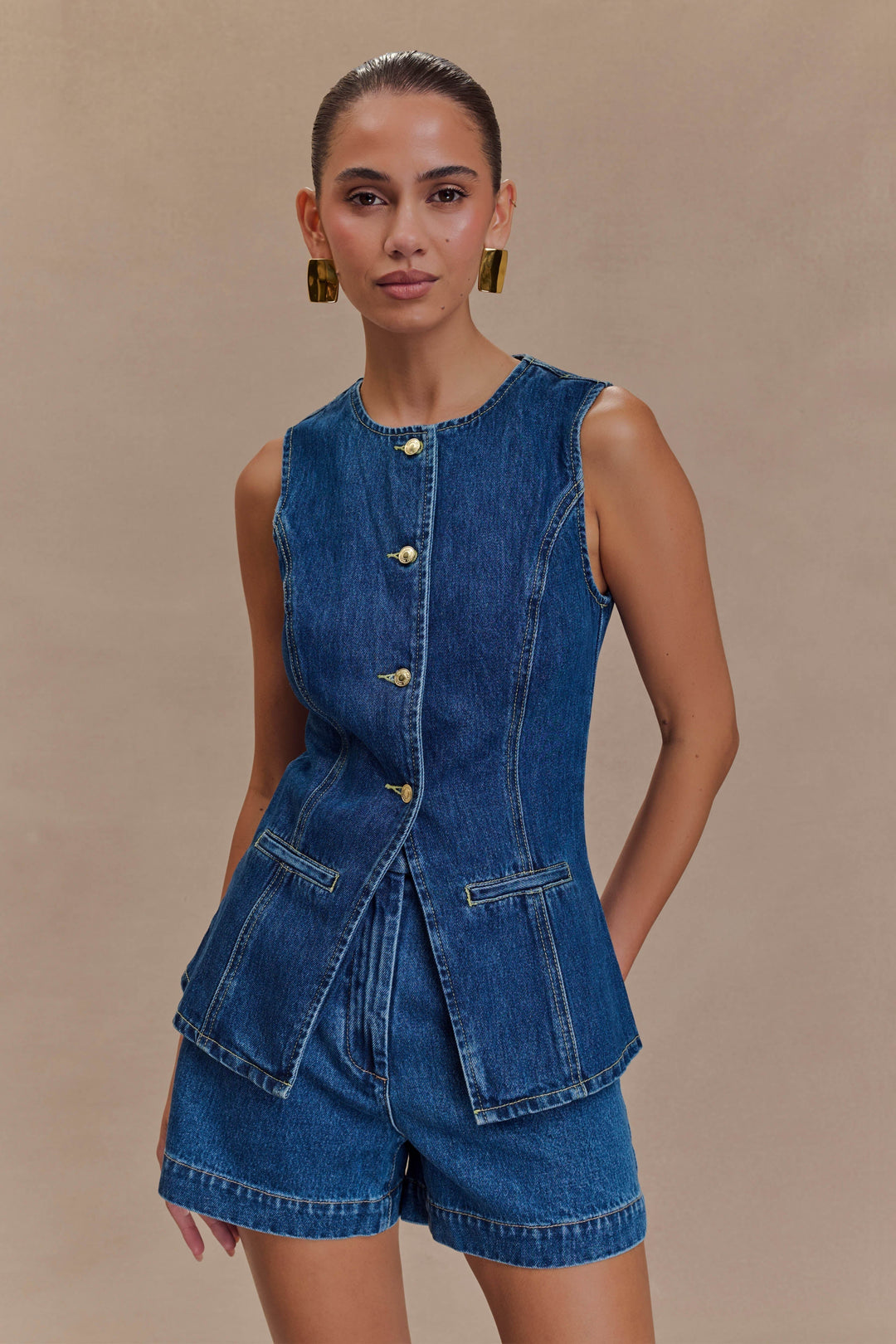 Stylish women's blue denim two-piece set, perfect for a chic and comfortable casual outfit.