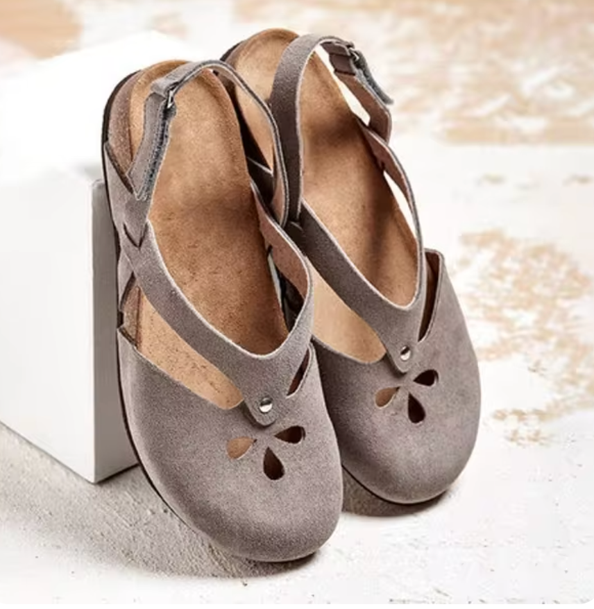 Women's stylish flat open-toe sandals. Casual footwear designed for everyday summer comfort.