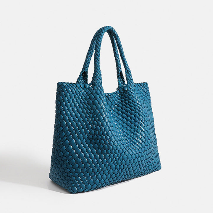 Fashionable large woven tote bag for women, ideal for everyday carry and style.
