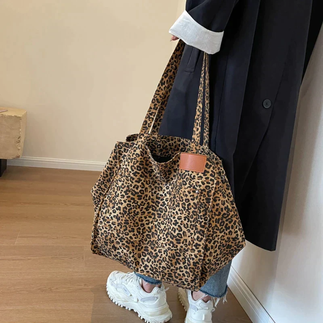 Elegant leopard print women's tote bag, a stylish and versatile fashion accessory for any outfit.