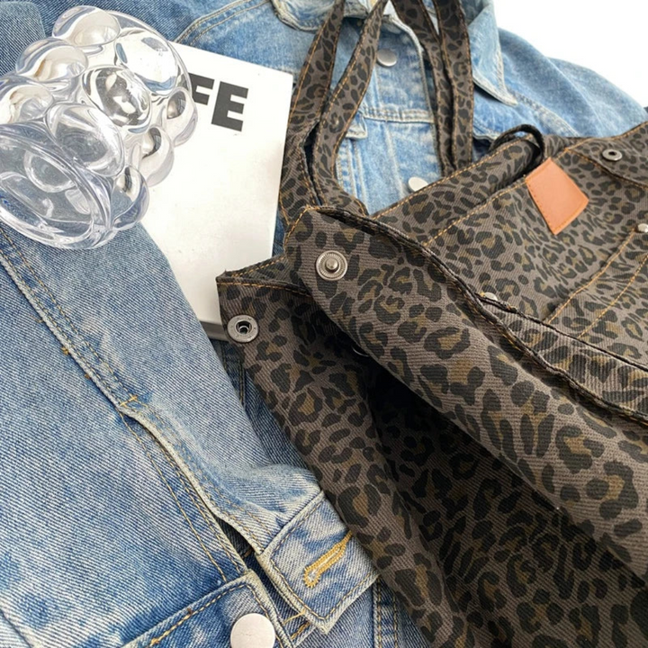 Brown & black leopard print women's handbag, a trendy & organized fashion accessory for daily essentials.