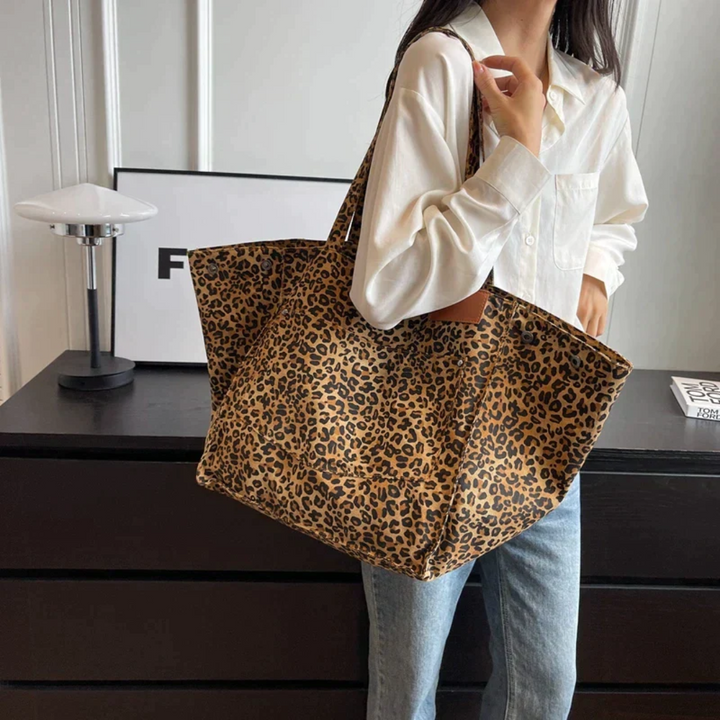 Bold leopard print women's tote bag, a stylish animal print shoulder bag accessory for a chic look.