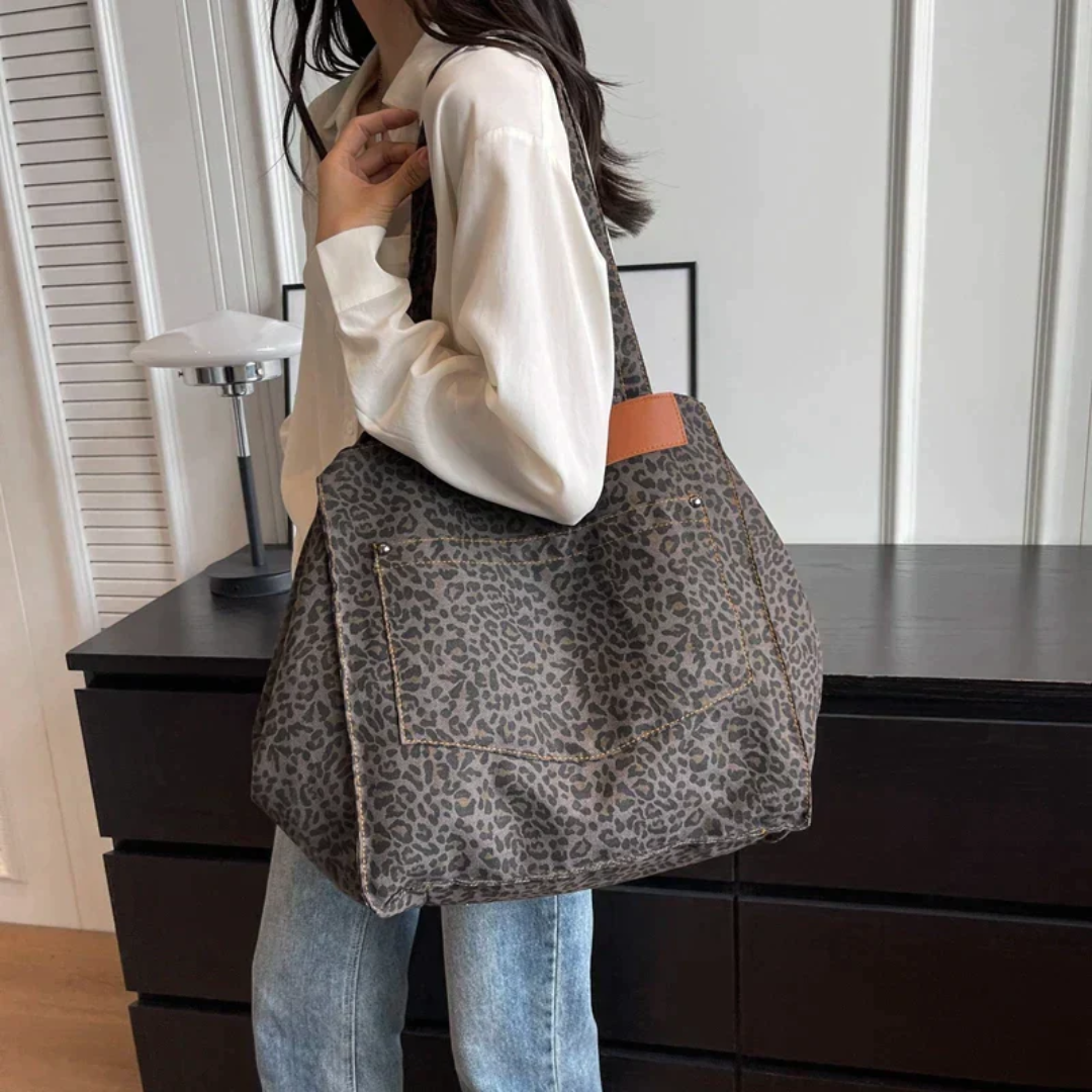 Glamorous leopard print fashion handbag for women, a chic accessory perfect for a stylish day out.