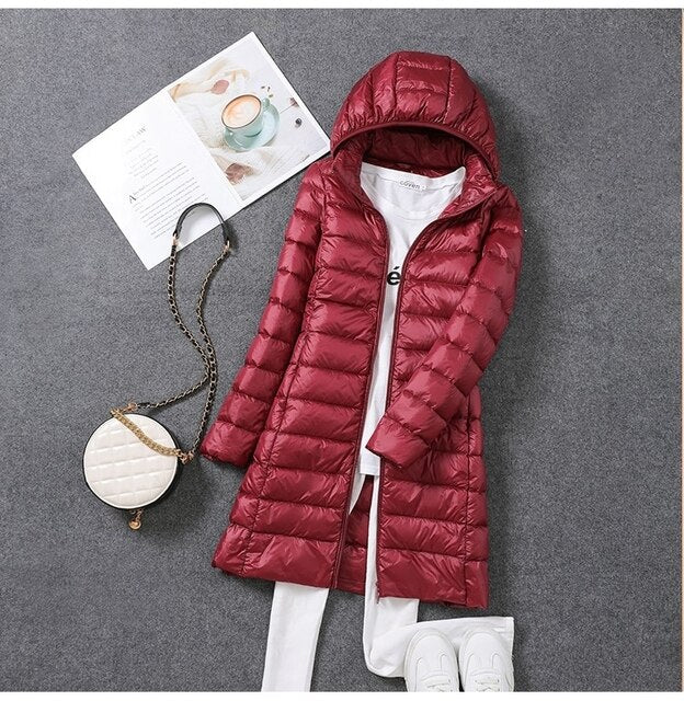Stylish women's long hooded winter coat, insulated for warmth and full coverage in cold weather.