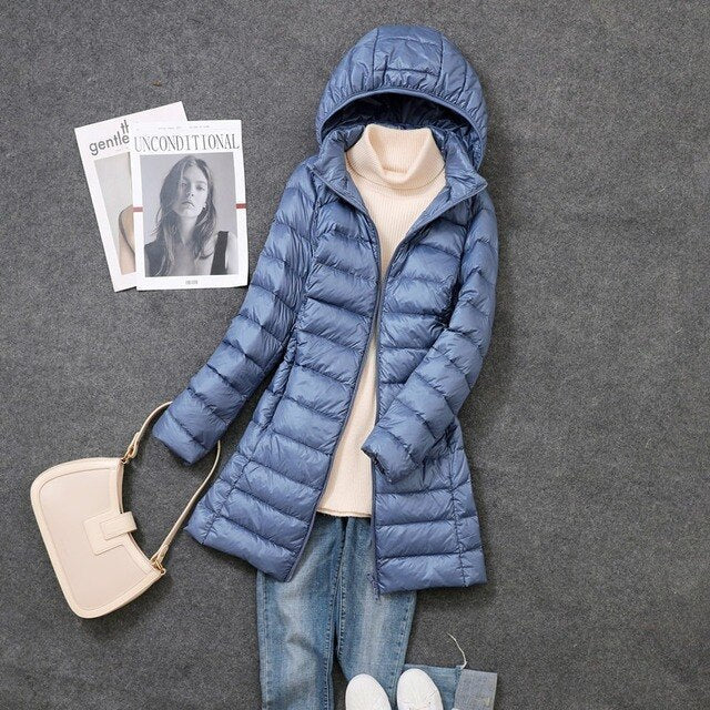 Full-coverage women's hooded long coat, designed for ultimate warmth and style during winter and cold conditions.