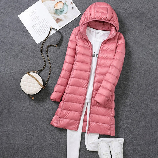 Elegant women's new long hooded winter coat, offering warmth, style, and essential cold weather protection.