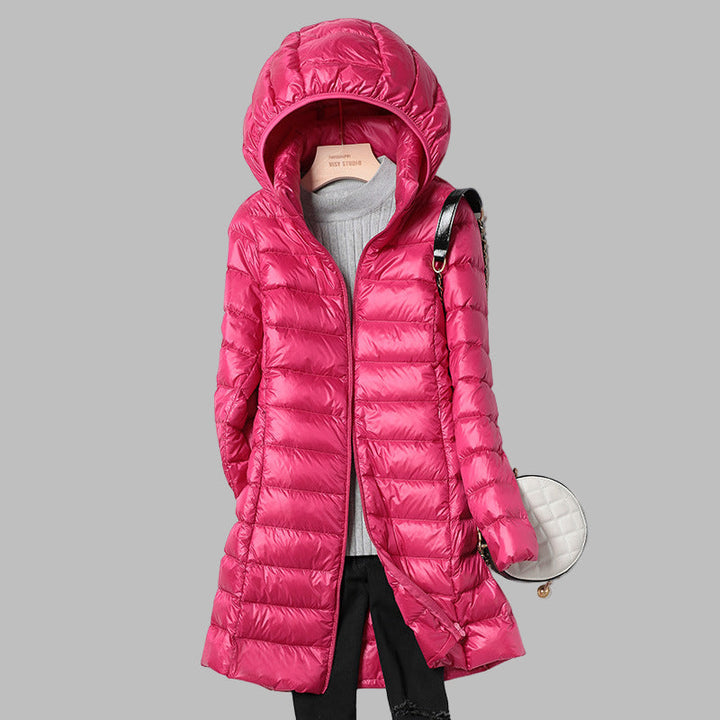 Versatile women's long winter outerwear, a stylish hooded coat providing warmth and full coverage for cold days.