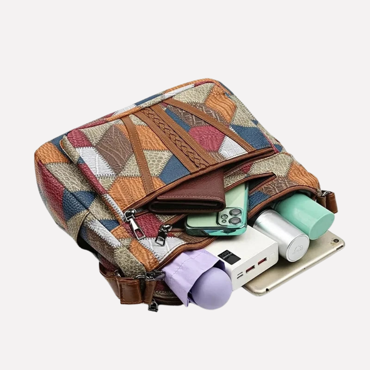 Elegant women's patchwork shoulder bag with chic braided handle & organized interior. A stylish everyday accessory.