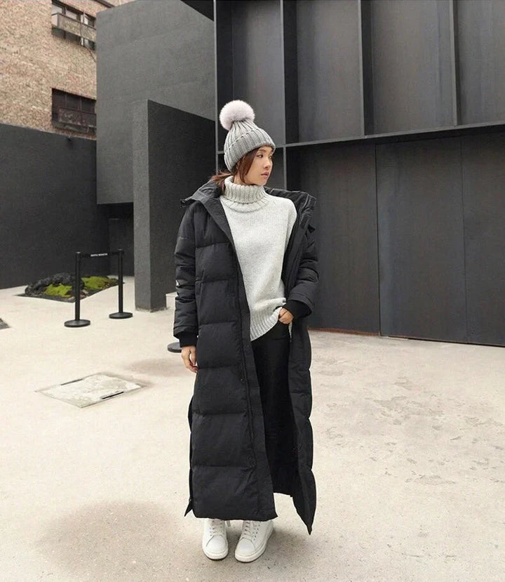 Elegant women's quilted long winter coat, warm outerwear, a stylish choice for fall & winter fashion.