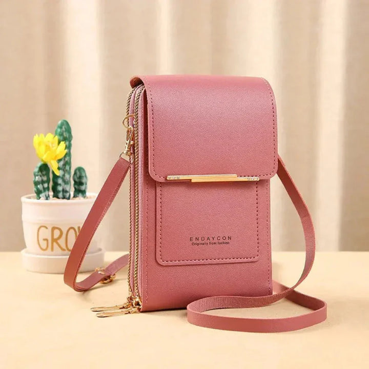 Women's crossbody bag with clear window for touchscreen phone. Secure & handy travel organizer for essentials.