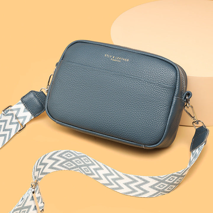 Front view of a sleek women's everyday crossbody bag, featuring secure design elements.
