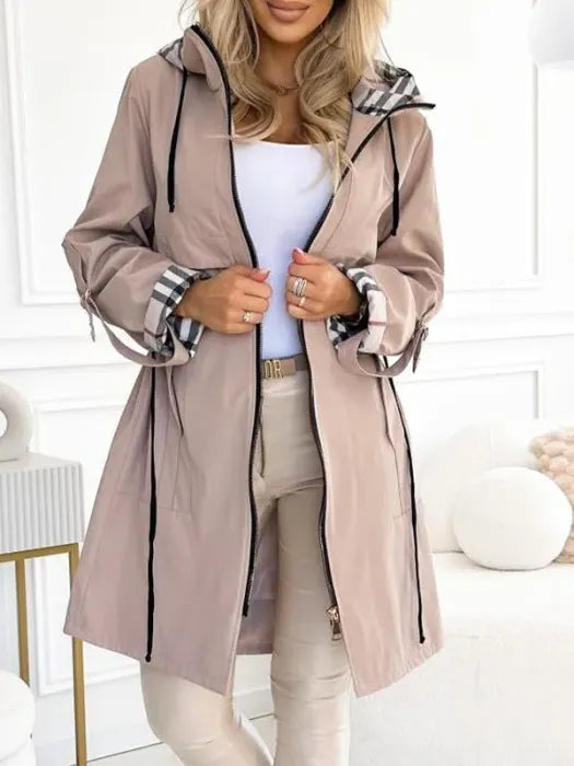 All-weather women's zip coat, waterproof & windproof, ideal for travel, everyday wear, and winter essentials.