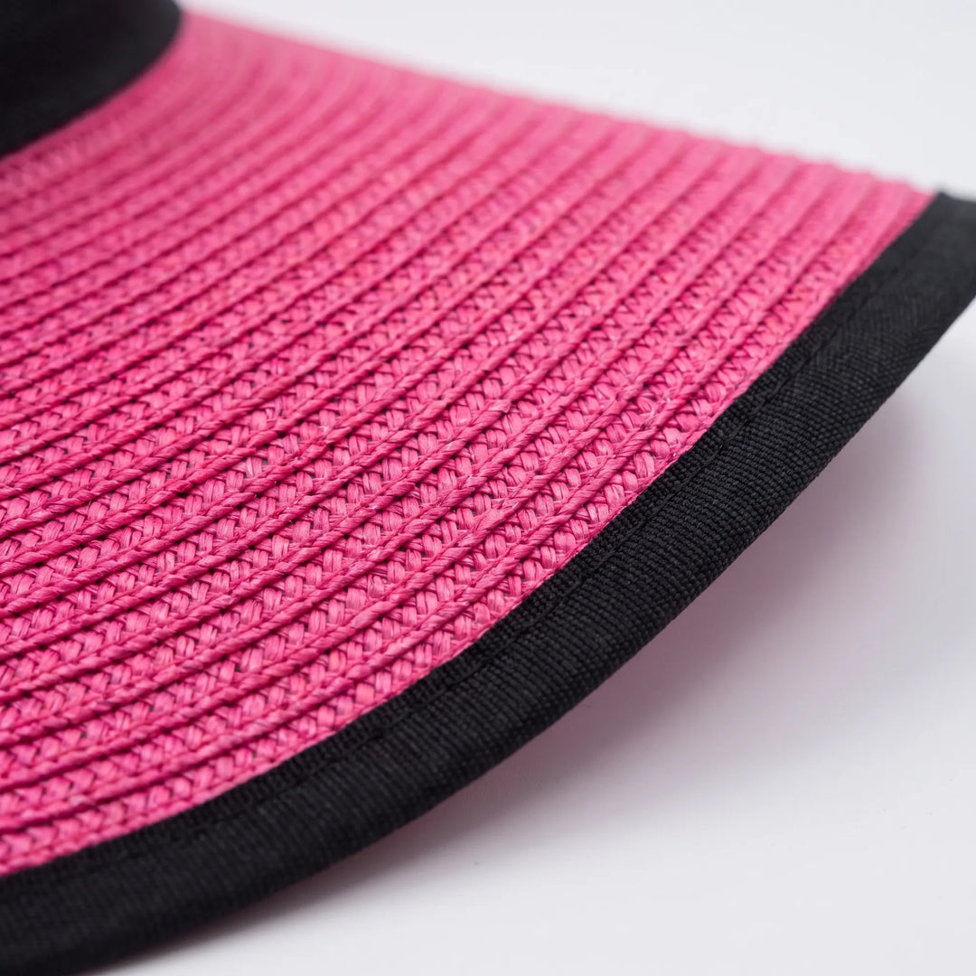 Elegant pink wide brim floppy sun hat for women. A chic summer accessory, perfect for beach trips & UV protection.