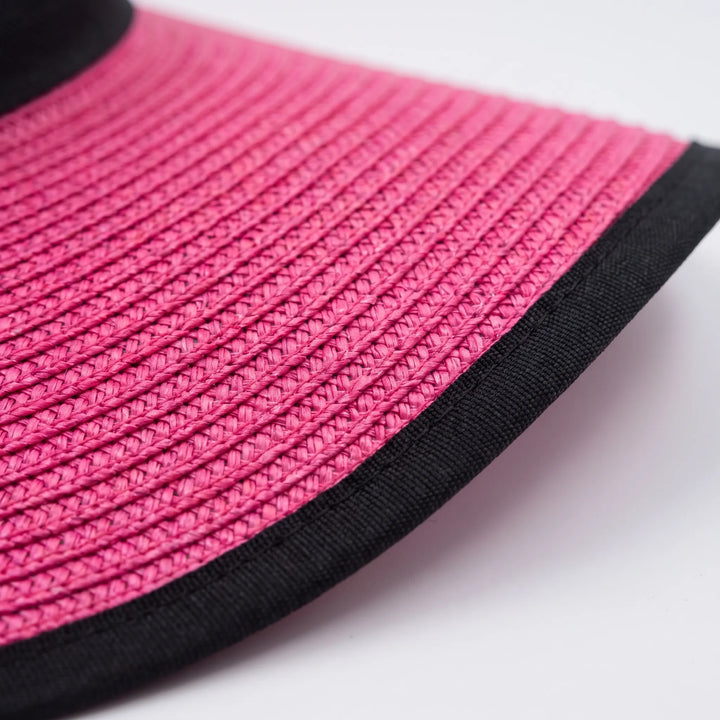 Elegant pink wide brim floppy sun hat for women. A chic summer accessory, perfect for beach trips & UV protection.