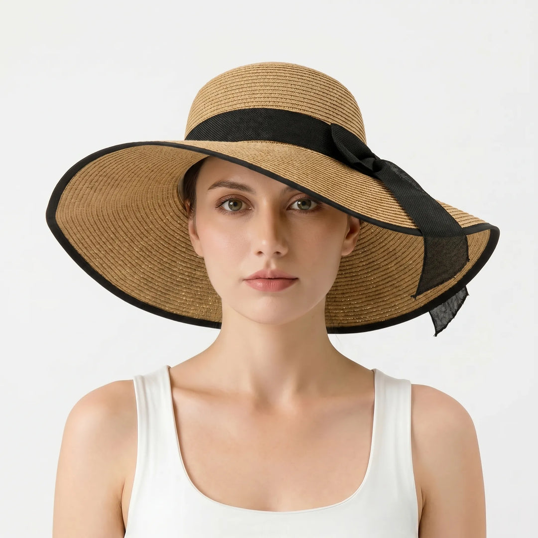 Lightweight women's wide brim floppy sun hat. Ideal for stylish beachwear, travel, and sunny outdoor summer activities.