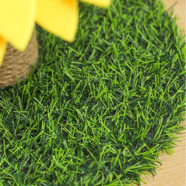 Adorable cat accessory: a sunflower-themed cat scratcher with a stable grass base for feline fun.