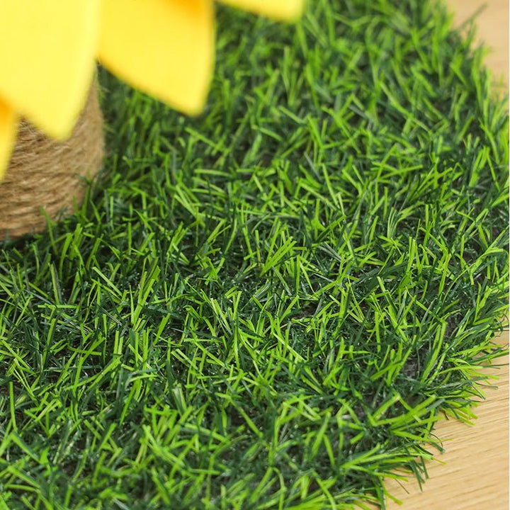 Adorable cat accessory: a sunflower-themed cat scratcher with a stable grass base for feline fun.