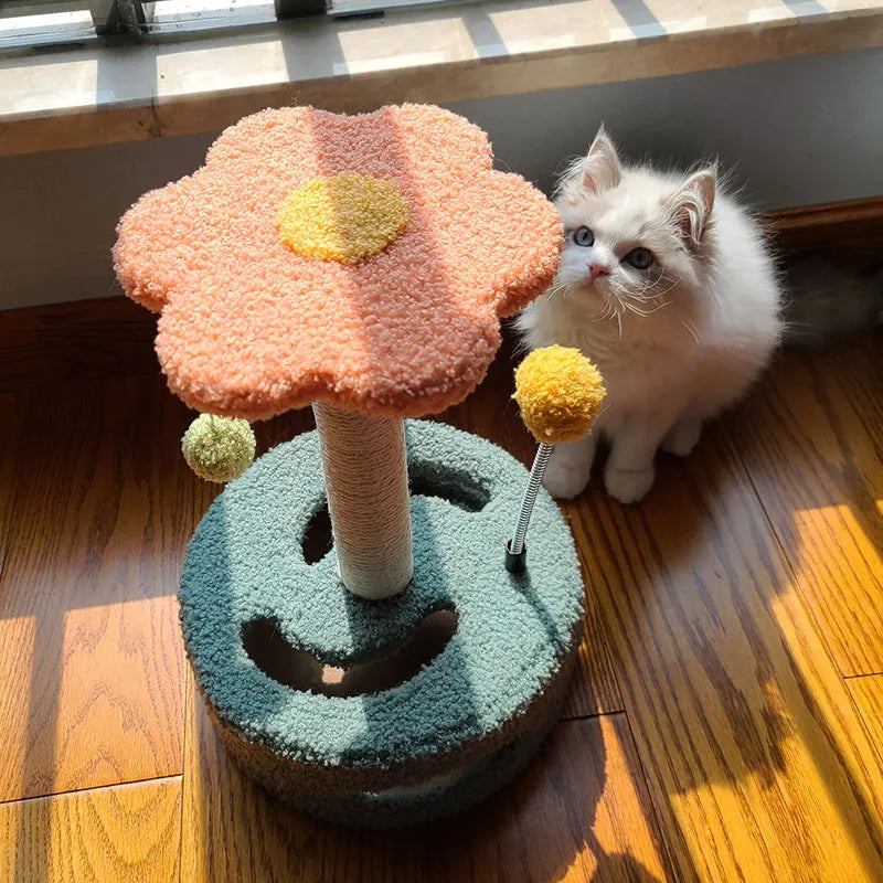 Sunflower cat scratching post with sisal and interactive toy, yellow and rosa for feline enrichment.