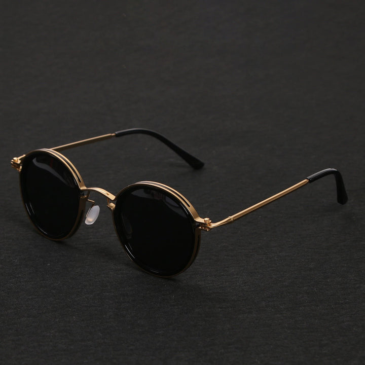 Unisex polarized round sunglasses with metal temples, offering 100% UV protection.