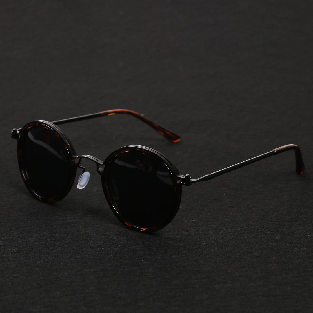 Classic unisex round polarized sunglasses with metal temples, providing essential UV protection.