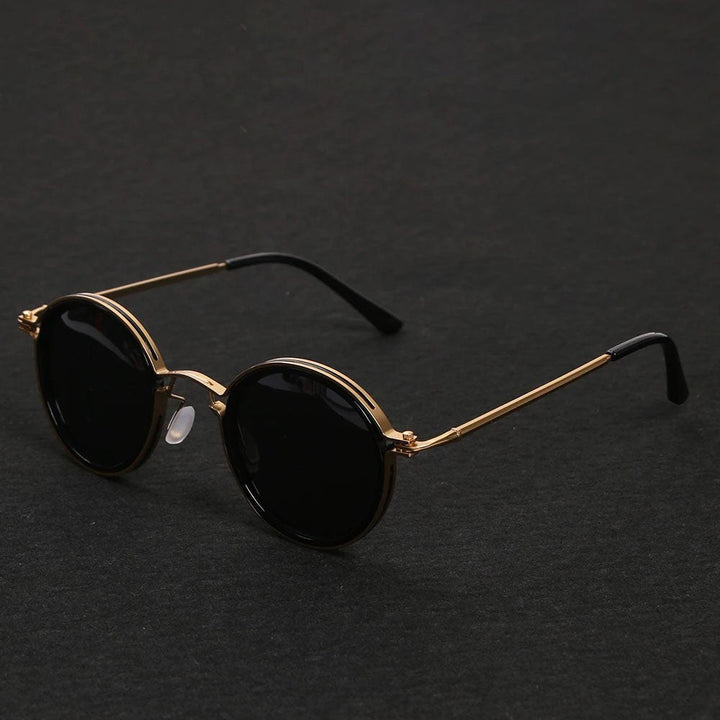 Elegant unisex polarized round sunglasses with sleek metal temples for style and UV defense.