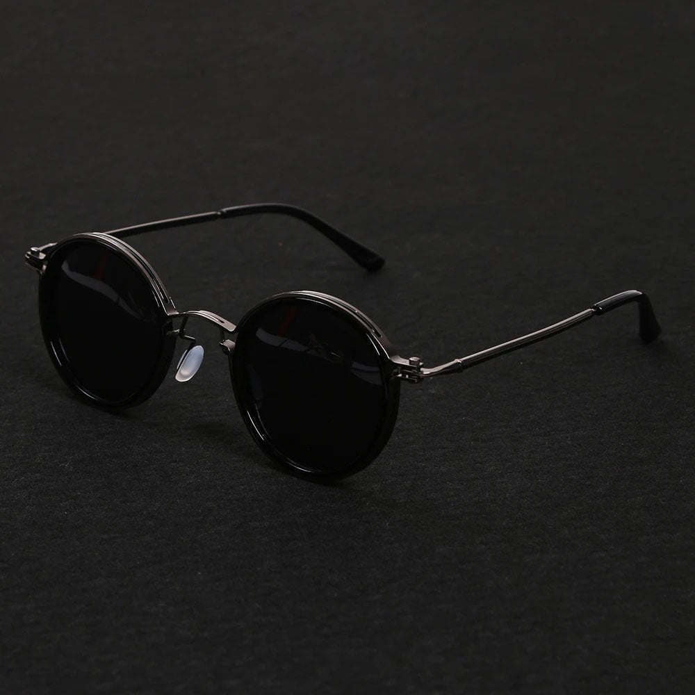 Unisex polarized round frame sunglasses. Classic style, metal temples, & full UV protection.