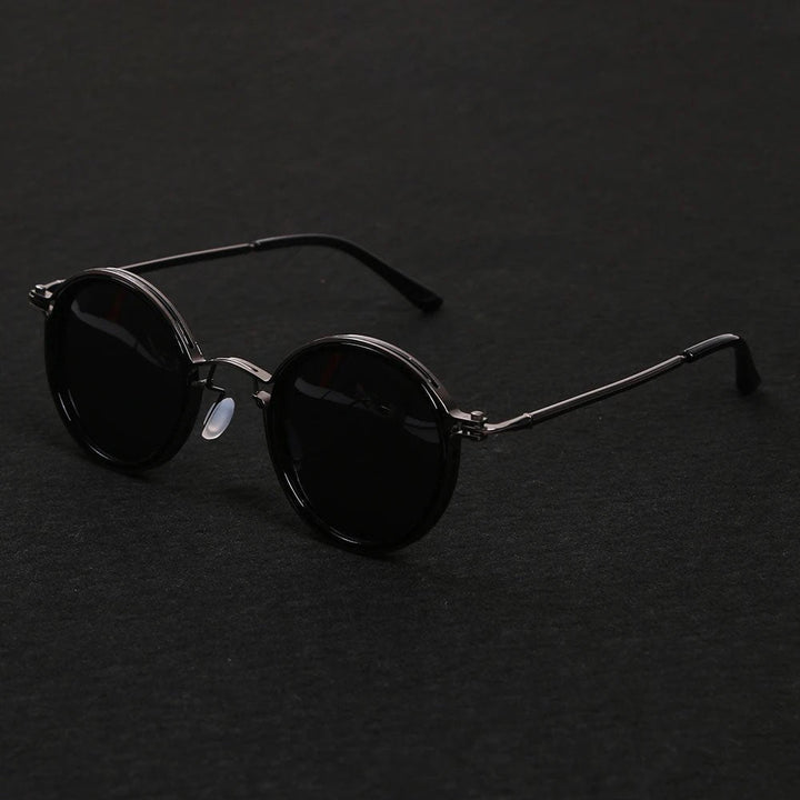 Unisex polarized round frame sunglasses. Classic style, metal temples, & full UV protection.