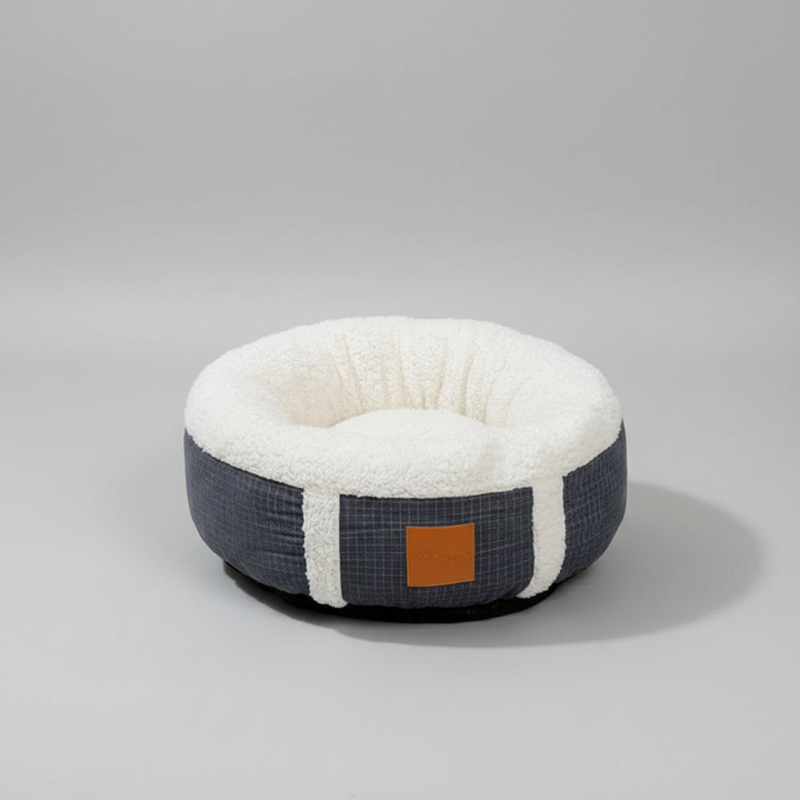 Plush pet calming bed, a super-soft winter nest for dogs & cats. Provides warmth & comfort, machine washable.