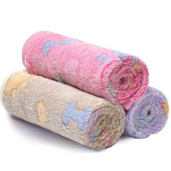 Stack of two machine washable coral velvet fleece pet blankets, perfect for dogs and cats, soft animal throws