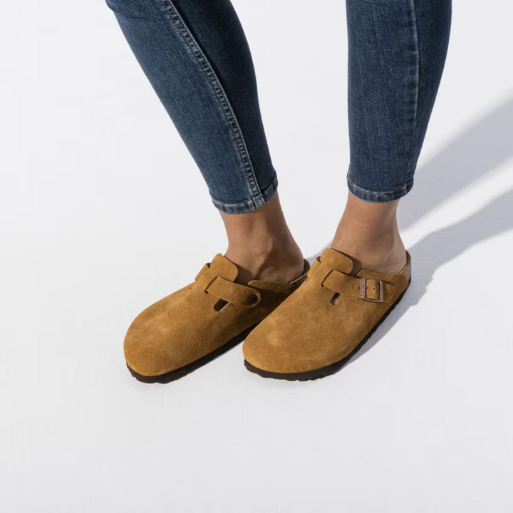 Taupe slip-on clogs for women, providing all-day comfort with their anatomical cushioned footbed.