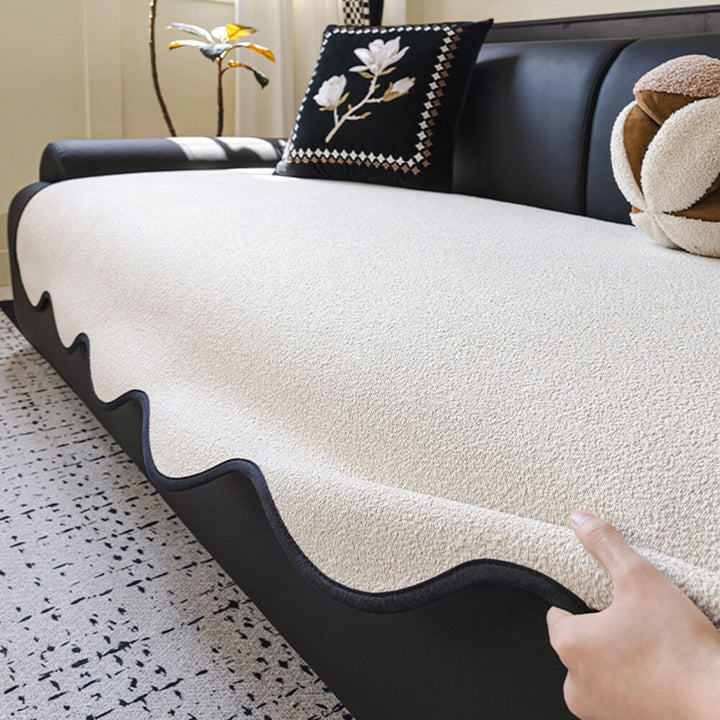 Full shot of a living room sofa with a teddy fleece water-repellent couch cover