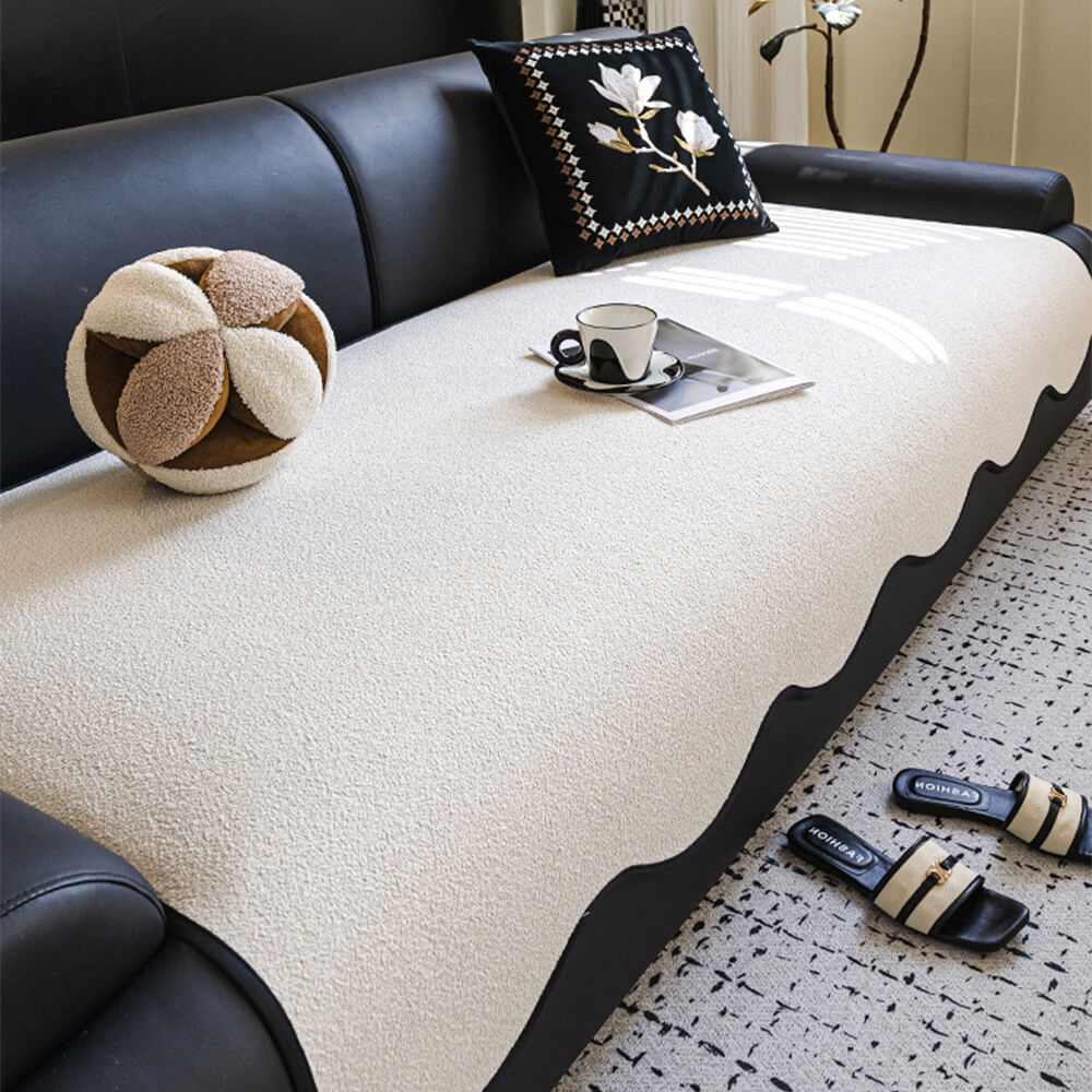 Teddy fleece couch cover with elastic straps for a secure, non-slip fit on furniture