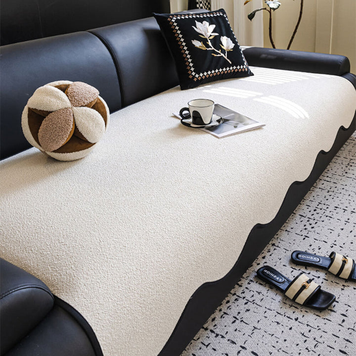 Teddy fleece couch cover with elastic straps for a secure, non-slip fit on furniture