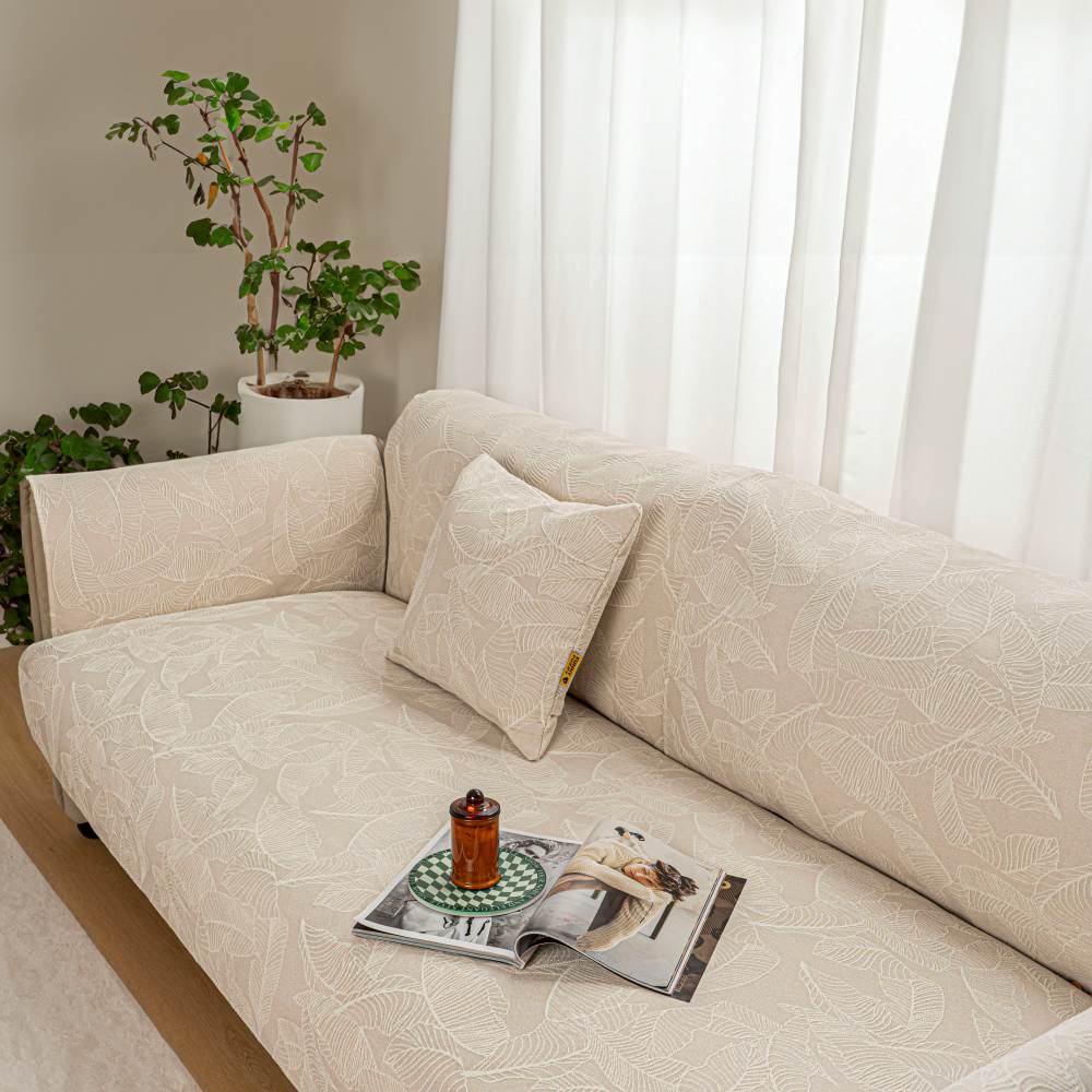Elegant textured jacquard sofa slipcover, a stylish home decor update for furniture.