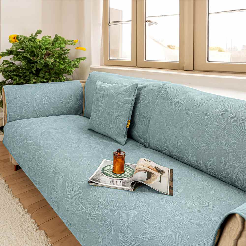 Close-up of jacquard texture on a durable sofa slipcover, protecting furniture from pets.