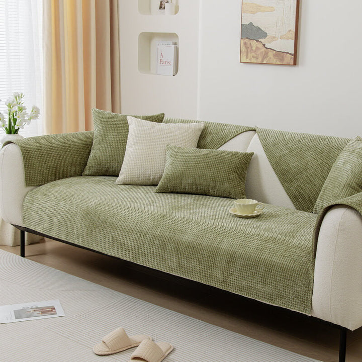 Textured Waffle Chenille Couch Cover in light gray, protecting a sofa from pets and spills.