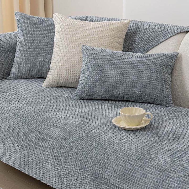 Textured Waffle Chenille Couch Cover in navy blue, offering a chic upgrade and protection to furniture.