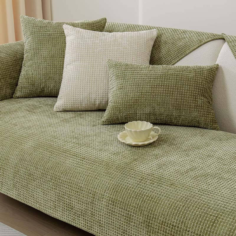 Machine washable Textured Waffle Chenille Couch Cover draped over a three-seater sofa.