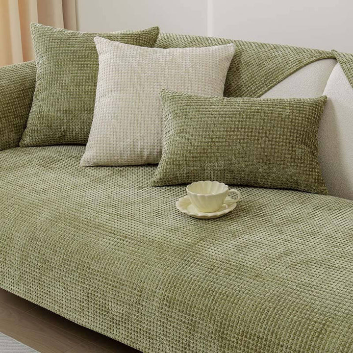 Machine washable Textured Waffle Chenille Couch Cover draped over a three-seater sofa.
